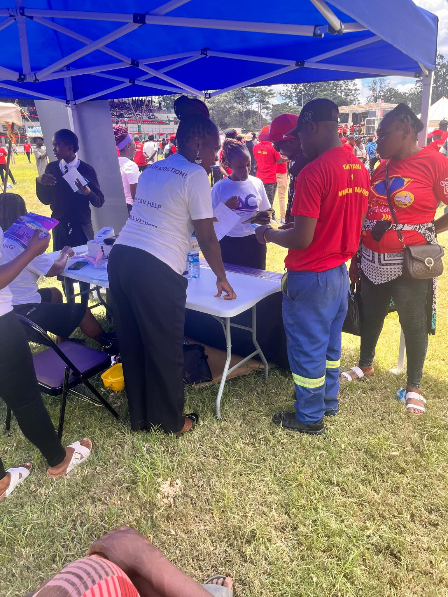 Another Chance team engaging visitors at a community outreach booth